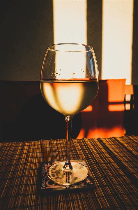 Photo Of Glass Of White Wine On Table · Free Stock Photo