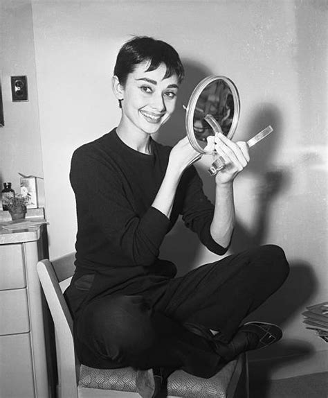 Audrey Hepburn Applying Makeup With Hand Mirror Pictures Getty Images