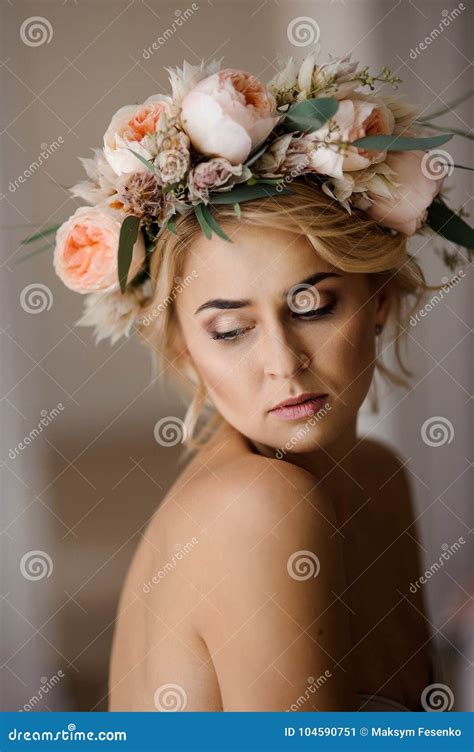 portrait of the beautiful topless blonde woman in a floral wreath with closed eyes stock image