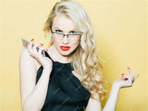 Premium Photo Sexy Blonde In Glasses With Phone