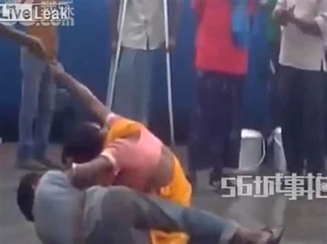 footage shows indian woman body slamming man at train station