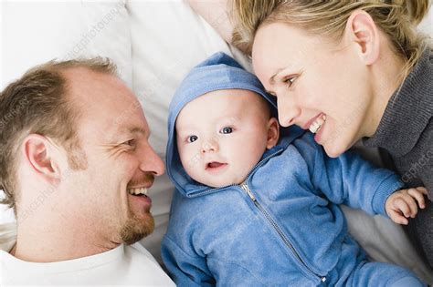 Baby Laying Between Dad And Mom Stock Image F0032212 Science
