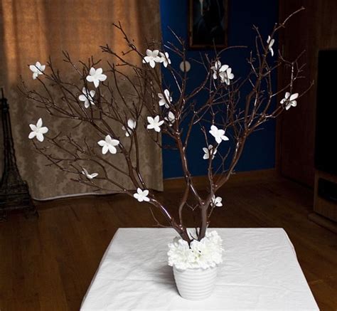 Lay out the branches so that they fan in opposite directions. Manzanita branches centerpieces with pearl Stephonatis | Weddingbee Photo Gallery