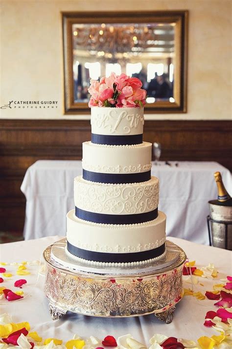Wedding Cake With Coral Flowers And Navy Blue Ribbon