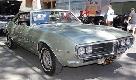 Here We See A 1968 Ohc 6 Powered Pontiac Firebird In What Appears To Be