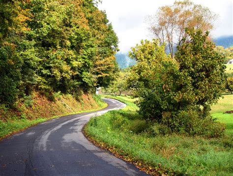 Curving Country Road Disappears Around The Bend Stock Photo Image Of