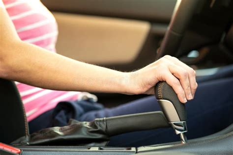 Close Up Of Woman Driver Holding Her Hand On Automatic Gear Shift Stick