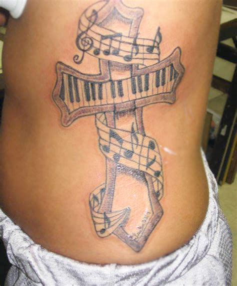 Guitar and music notes tattoo. 15 Creative Musical Notes Tattoo Designs | Amazing Tattoo ...
