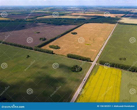 Picturesque Aerial View Of Farmland On Multicolored Fields With Crops