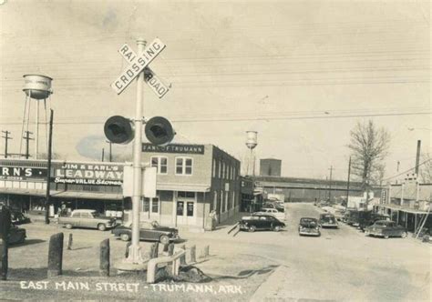 An Old Black And White Photo Of A Street Corner