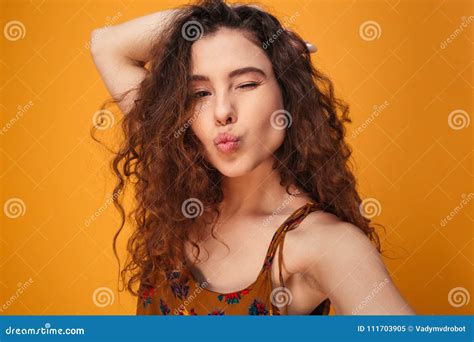 close up portrait of a flirty curly haired girl stock image image of isolated emotion 111703905