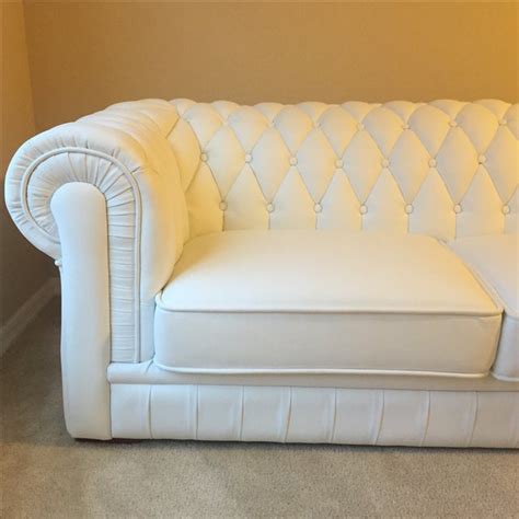 White Leather Tufted Back Sofa | Chairish Sturdy wood frame that fits in tight spaces.