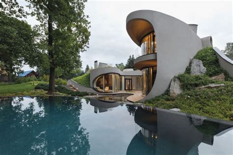 An Organic House Surrounded By Artificially Created Landscape