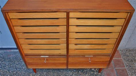 Despite their varied styles, they actually have the same function as storage. Teak Tambour Door Flat File Storage Cabinet at 1stdibs