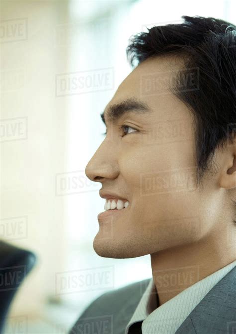 Businessman Smiling Close Up Side View Of Face Stock Photo Dissolve