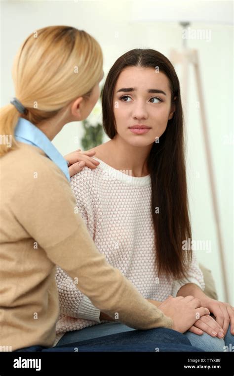 Woman Hugging Her Depressed Friend At Home Stock Photo Alamy