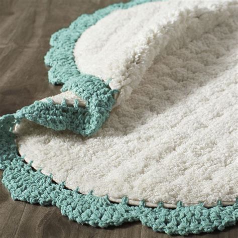 While bath rugs are the more stylish option, they usually are not equipped to deal with water as well as bath mats. Crochet Edge Teal Bath Rug | Everything Turquoise