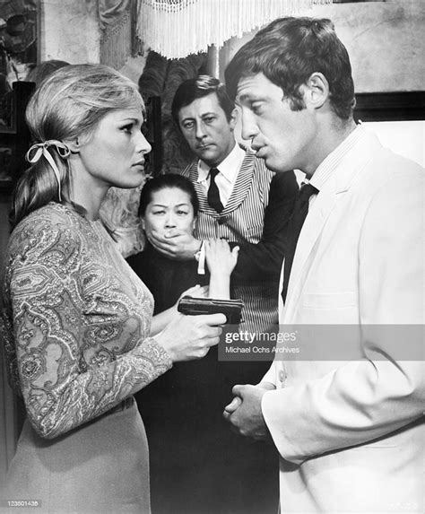 Ursula Andress Holds Gun On Jean Paul Belmundo In A Scene From The