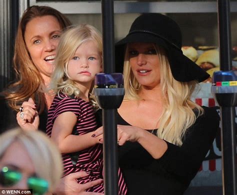 jessica simpson is stunning in floppy black hat and playsuit as she brings daughter maxwell to