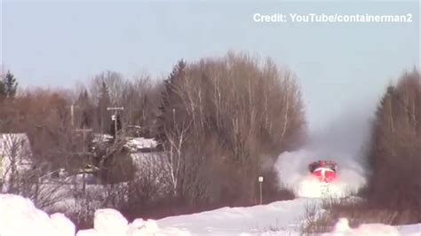 Watch New Brunswick Man Captures Train Plowing Through Snow Drifts