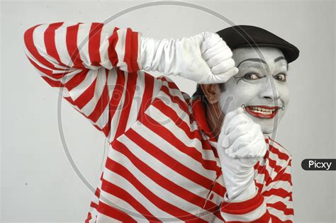 Image Of Male Mime Artist With Gestures Isolated Over White Background