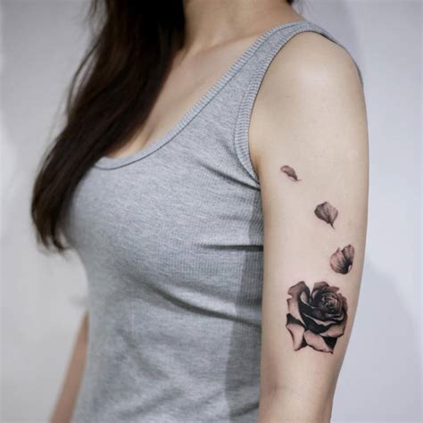 Rose Blooming Tattoo On The Left Upper Arm