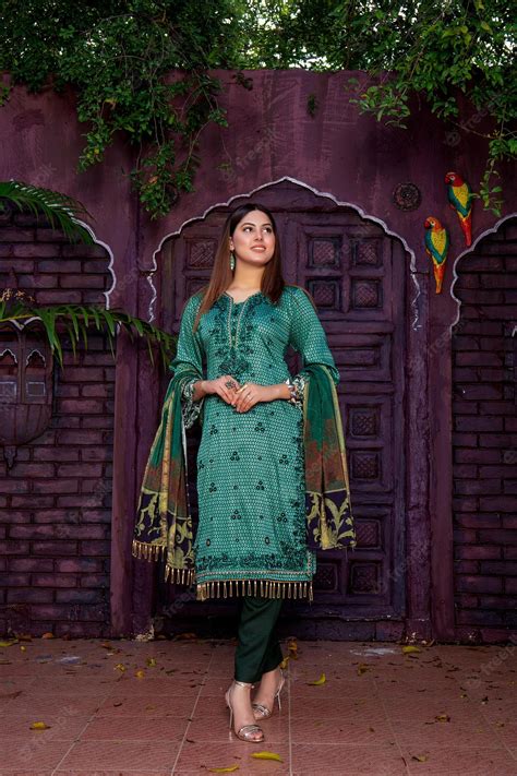 Premium Photo Hot Pakistani Girl Wearing Desi Dress For Traditional Photoshoot Under Trees