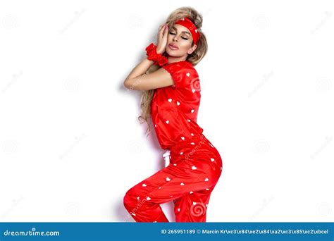 Valentine Girl In Red Lingerie Is Holding Red Hearts On Red Background