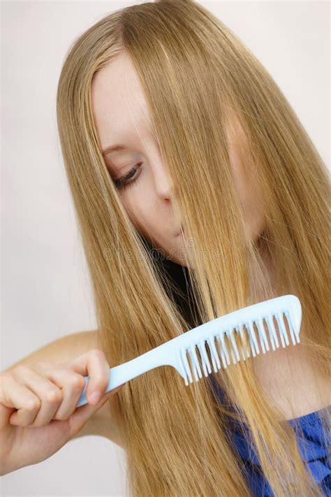 Woman Combing Long Healthy Blonde Hair Stock Photo Image Of Girl