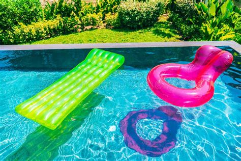 Colorful Swim Ring Or Rubber Float Around Swimming Pool Water Stock
