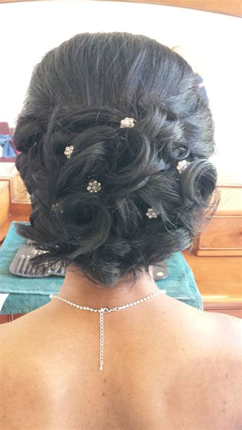 This hairstyle is flattering for long, wavy, curly and straight hair. Wedding Hair: A Curly Bun with Pretty Pins | Bridal Up Do ...