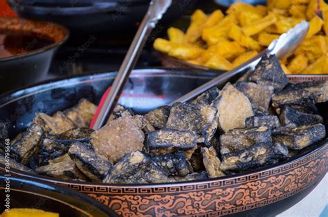 Black Chinese Stinky Tofu In Big Plate Seen From China Local Street