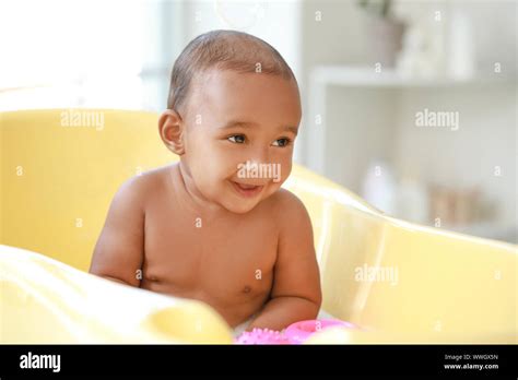 Little African American Baby Washing In Bathtub At Home Stock Photo Alamy