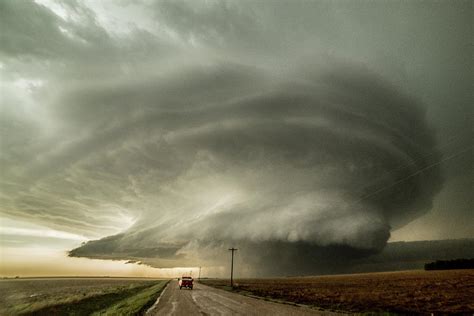 Storm Chaser Driving Towards An Supercell That Has Already Produced