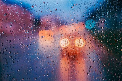 Water Drops Of Rain On Glass Background Street Bokeh Lights Ou Stock