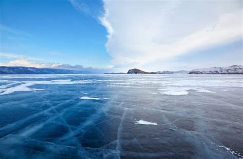 Winter Ice Landscape On Lake Baikal With Dramatic Weather Clouds Stock