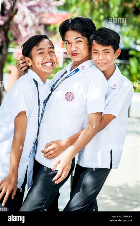 Playful Filipino School Children Pose In A Park In Angeles City The