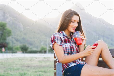 Girl Drinking Red Smoothie In Park High Quality People Images ~ Creative Market