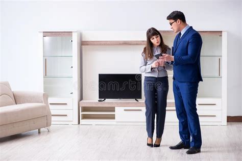 The Real Estate Agent Showing New Apartment To Owner Stock Image