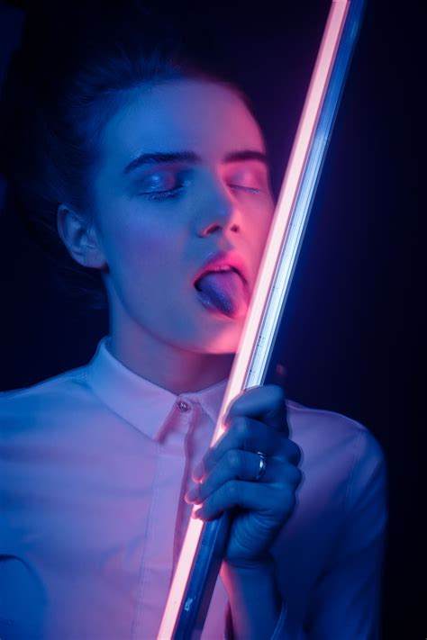 Hd Wallpaper Woman Showing Her Tongue While Holding Fluorescent Tube One Person Wallpaper Flare