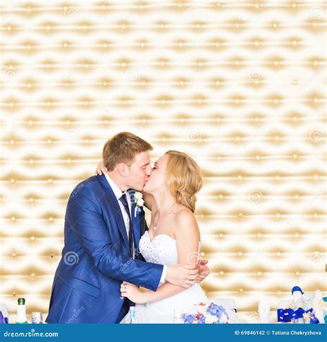 Stylish Gorgeous Happy Bride And Groom Kissing At Wedding Reception Emotional Cheerful Moment