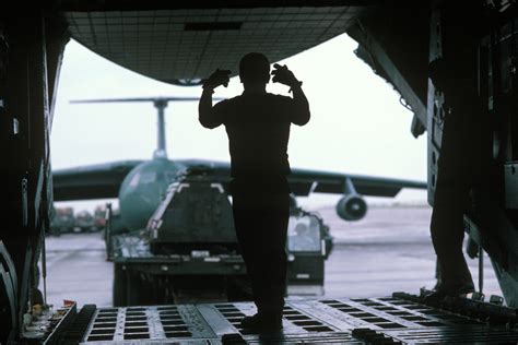 A Member Of The 628th Military Airlift Support Squadron Directs A K