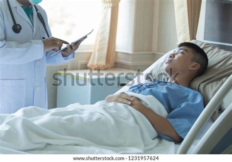 Doctor Treating Patients Hospitaldoctor Uses Tablet Stock Photo