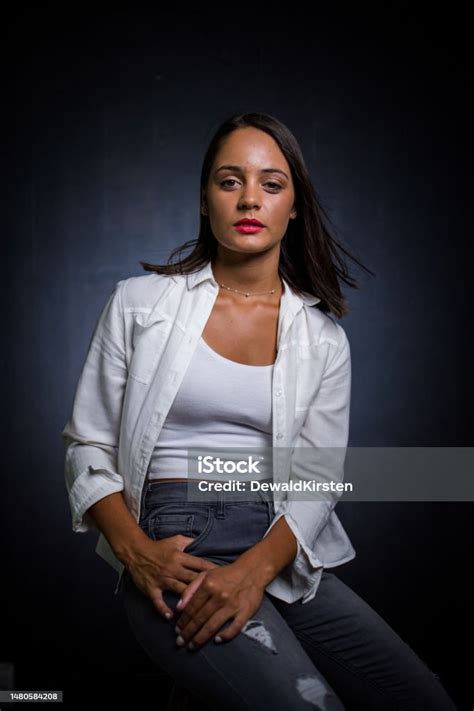 Close Up Image Of A Dark Haired Girl Posing For A Fashion Shoot In A
