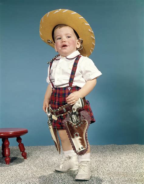 1950s 1960s Little Boy Wearing Cowboy Photograph By Vintage Images Pixels