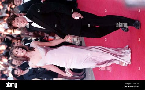 Liz Hurley And Hugh Grant Arrive At The 50th Cannes Film Festival For