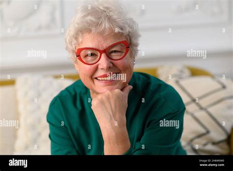 Smiling 60s Middle Aged Woman Looking At Camera Happy Mature Elegant Old Lady Posing At Home
