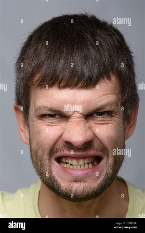 Closeup Portrait Of A Madly Evil Man Of European Appearance Stock Photo
