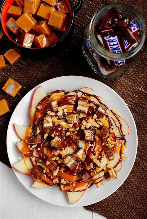 This apple snickers salad recipe is a sweet and sour side dish with crunchy green apples, marshmallows, and snickers candy bars as ingredients. Ultimate Apple Snicker Nachos - Iowa Girl Eats | Recipe | Sweet snacks, Food, Iowa girl eats