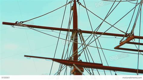 Masts And Rigging Of Three Masted Sailing Ship Over The Bright Blue Sky